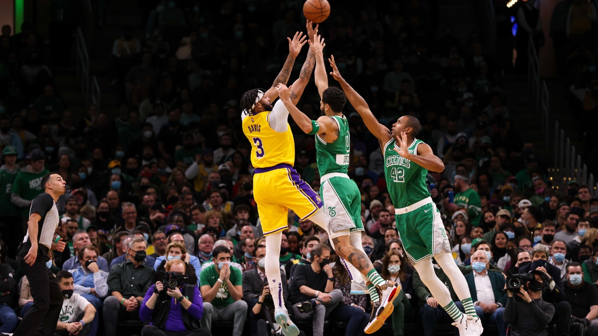 Los Angeles Lakers forward Anthony Davis (3), Boston Celtics forward Al Horford (42) and Boston Celtics forward Jayson Tatum (0)
