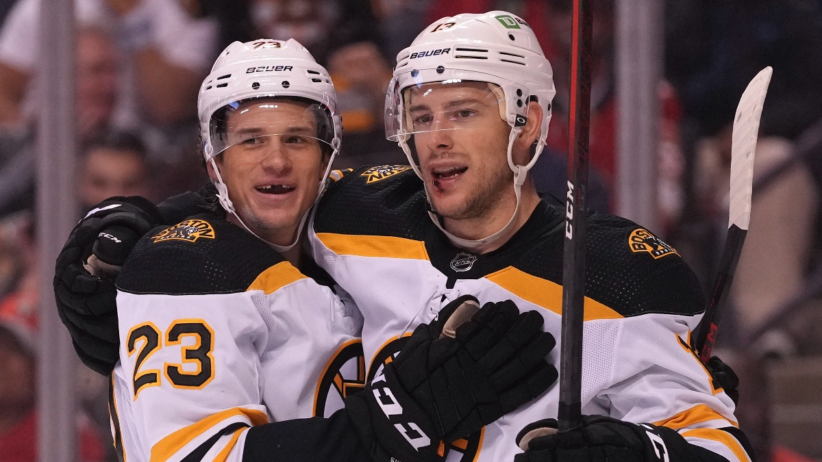 Boston Bruins centers Jack Studnicka (right) and Charlie Coyle vs. the Winnipeg Jets
