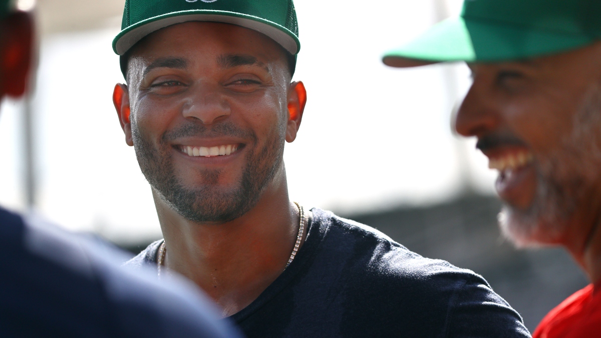 Boston Red Sox shortstop Xander Bogaerts and manager Alex Cora (right)