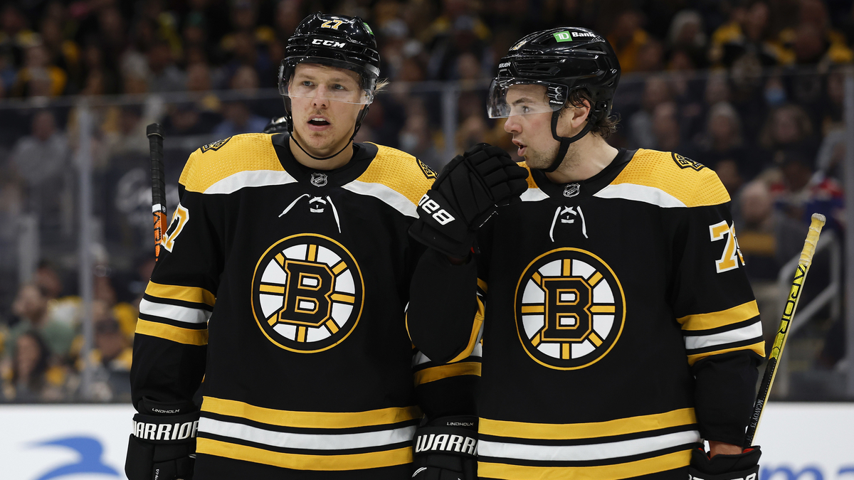 Boston Bruins defensemen Hampus Lindholm and Charlie McAvoy