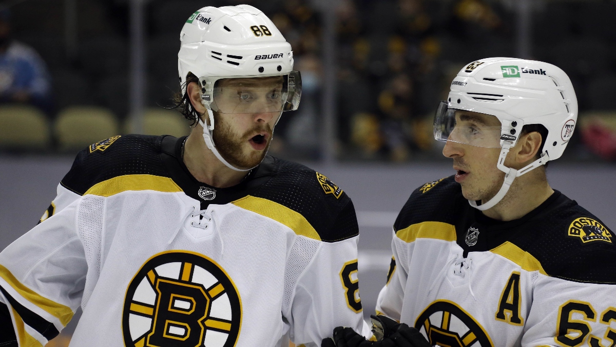 Boston Bruins right wing David Pastrnak (88) and left wing Brad Marchand (63)