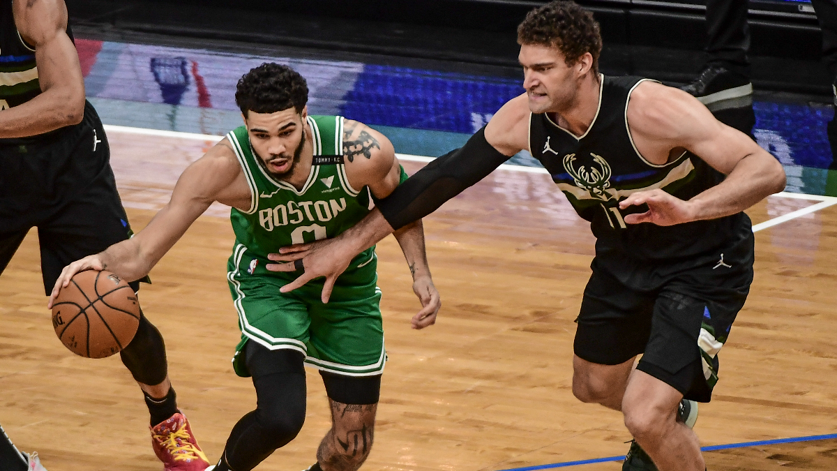 Boston Celtics forward Jayson Tatum and Milwaukee Bucks forward Brook Lopez