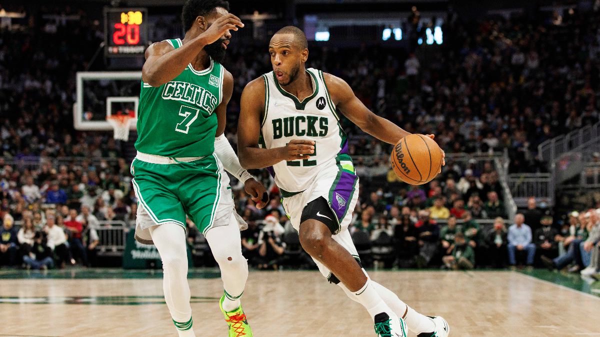 Milwaukee Bucks forward Khris Middleton (right) and Boston Celtics guard Jaylen Brown (left)