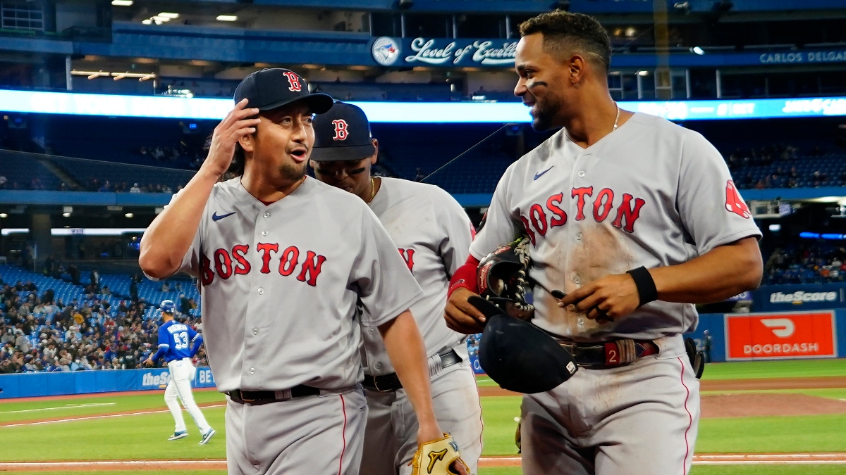 Boston Red Sox pitcher Hirokazu Sawamura (18) and shortstop Xander Bogaerts (2)