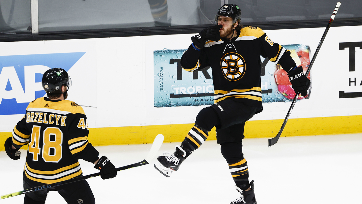 Boston Bruins defenseman Matt Grzelcyk, forward David Pastrnak