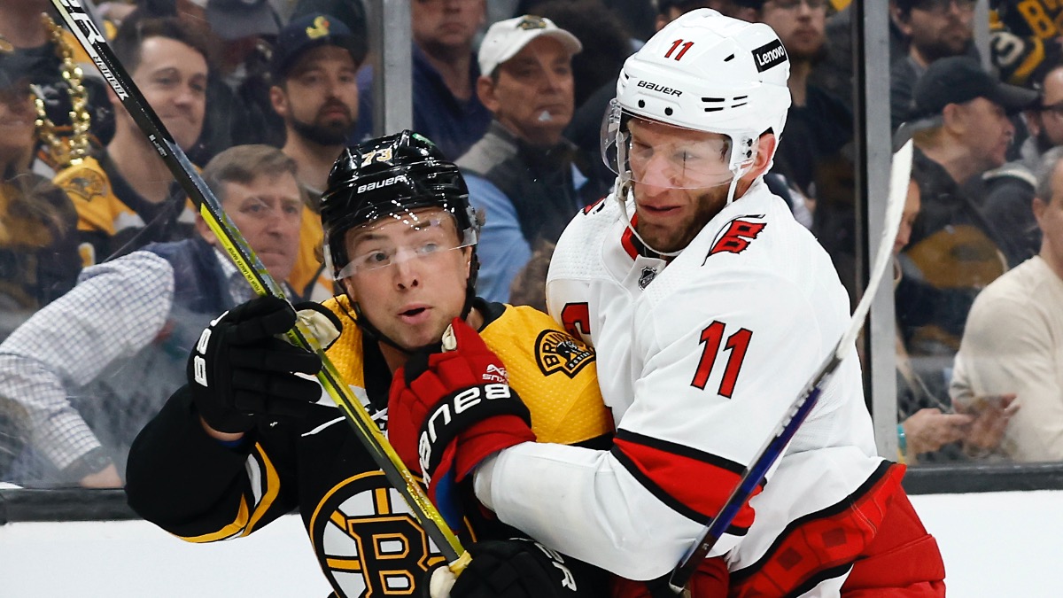 Boston Bruins defenseman Charlie McAvoy, Carolina Hurricanes center Jordan Staal