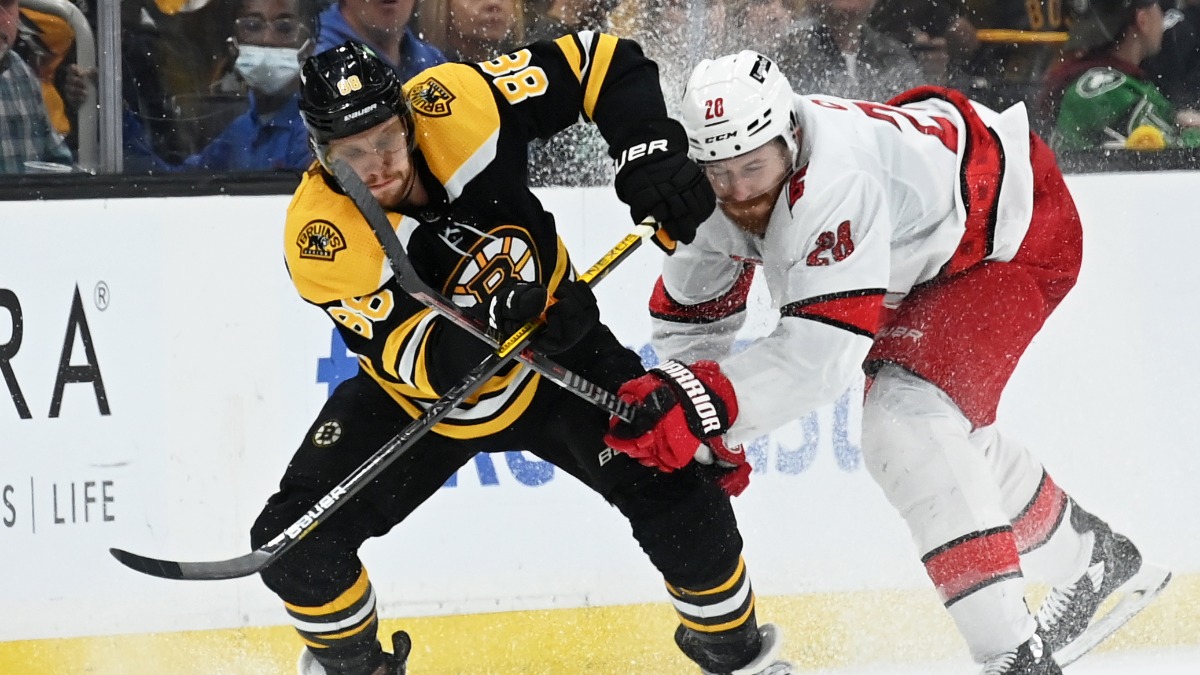 Boston Bruins right wing David Pastrnak, Carolina Hurricanes defenseman Ian Cole