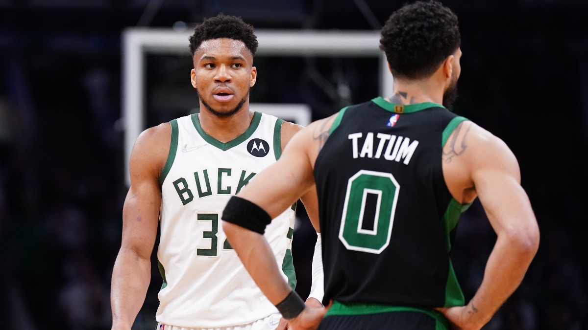 Milwaukee Bucks forward Giannis Antetokounmpo (34) and Boston Celtics forward Jayson Tatum (0)