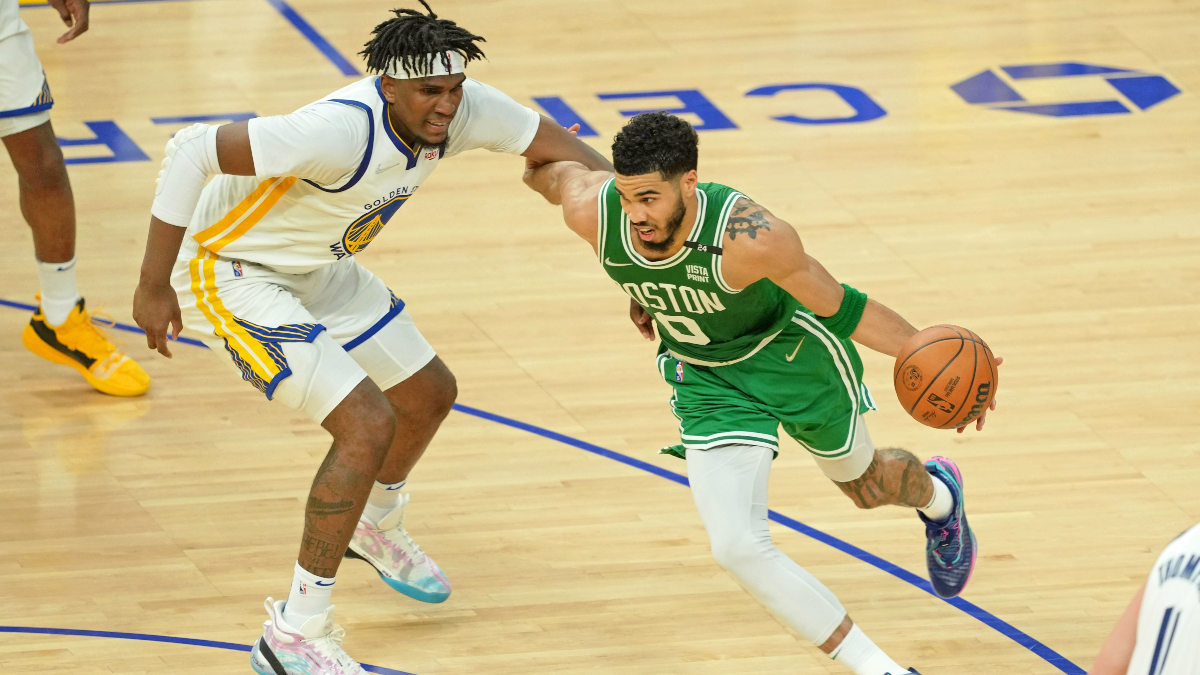 Boston Celtics forward Jayson Tatum and golden State Warriors forward Kevon Looney