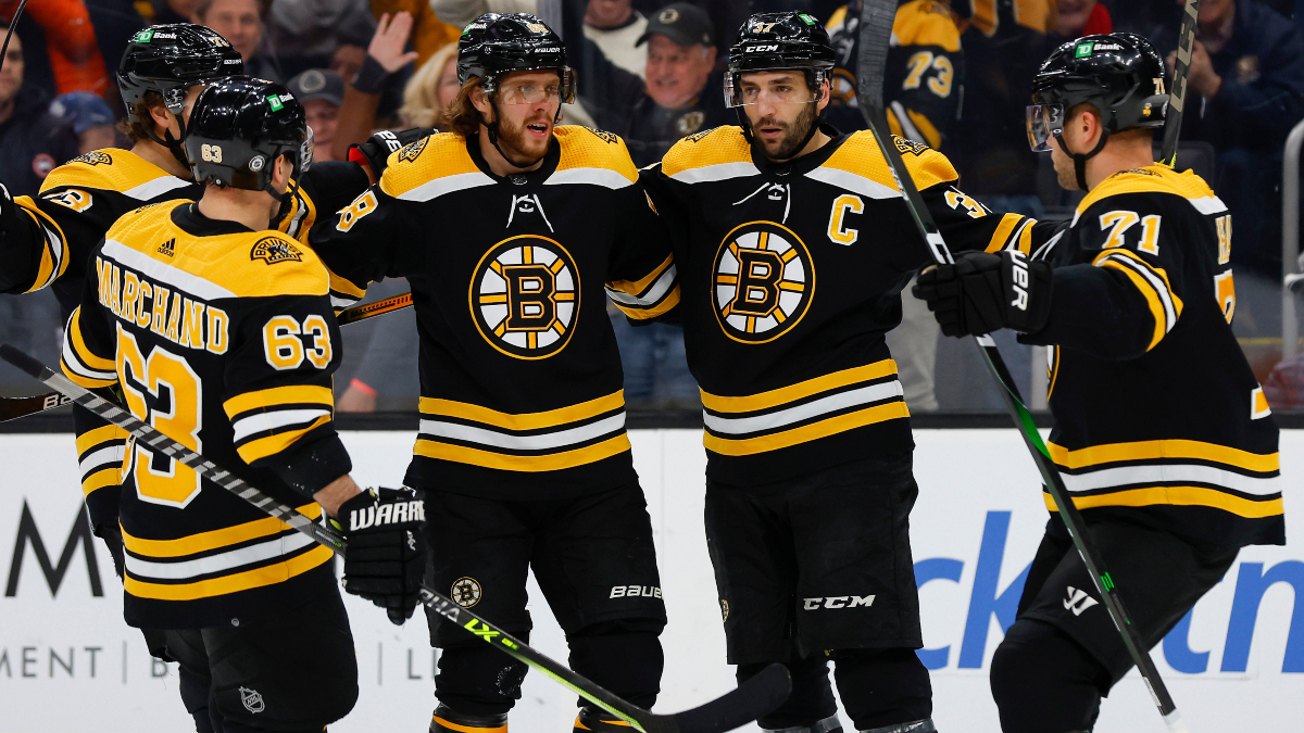 Boston Bruins players Patrice Bergeron, David Pastrnak, Brad Marchand and Taylor Hall