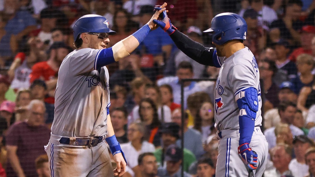 Toronto Blue Jays catcher Danny Jansen (9), designated hitter George Springer (4)