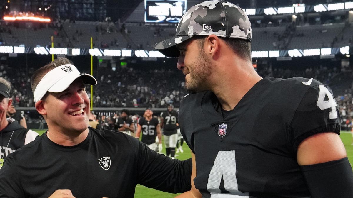 Las Vegas Raiders coach Josh McDaniels (left) and quarterback Derek Carr