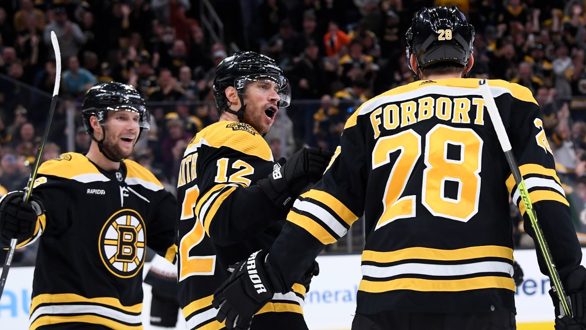 Boston Bruins defenseman Derek Forbort, forwards Craig Smith and Pavel Zacha
