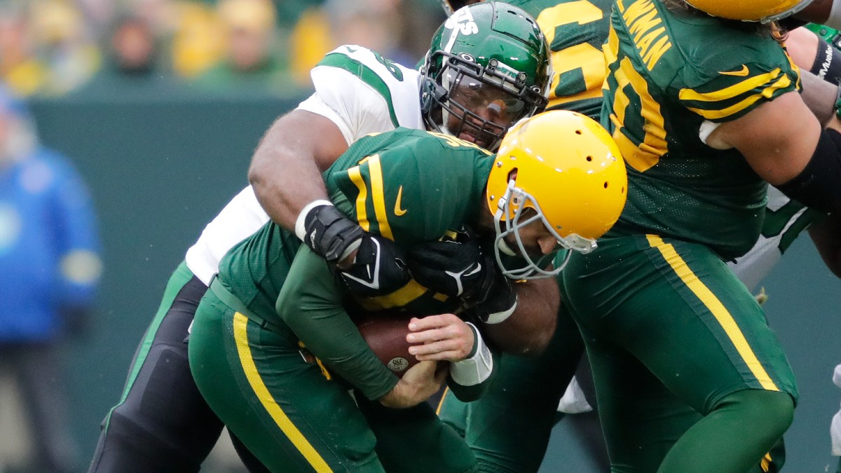 Green Bay Packers quarterback Aaron Rodgers, New York Jets Sheldon Rankins
