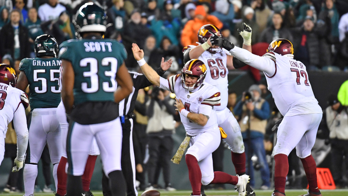 Philadelphia Eagles defensive end Brandon Graham and Washington Commanders quarterback Taylor Heinicke
