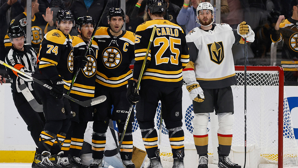 Boston Bruins forwards Brad Marchand, Jake DeBrusk and Patrice Bergeron