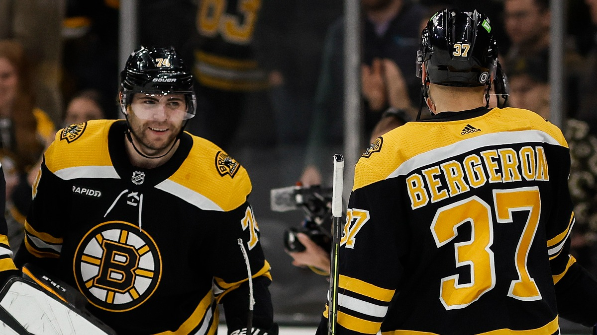 Boston Bruins left wing Jake DeBrusk and center Patrice Bergeron