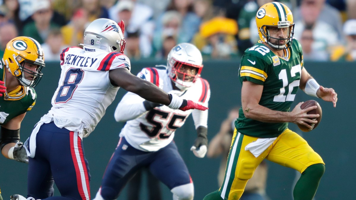 New England Patriots linebacker Ja'Whaun Bentley and Green Bay Packers quarterback Aaron Rodgers