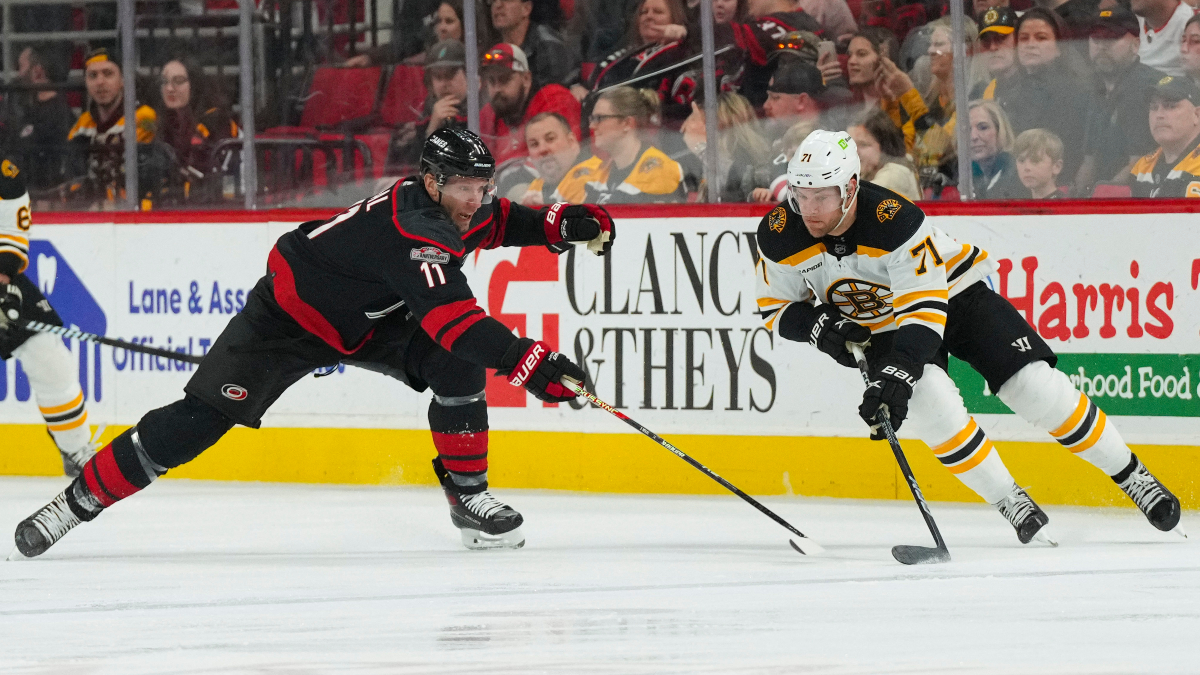 Boston Bruins forward Taylor Hall and Carolina Hurricanes forward Jordan Staal