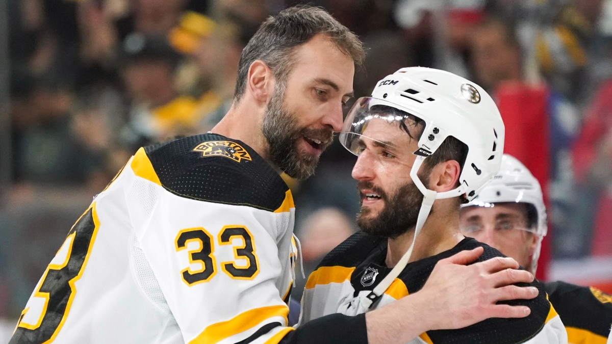 Retired Boston Bruins defenseman Zdeno Chara, center Patrice Bergeron