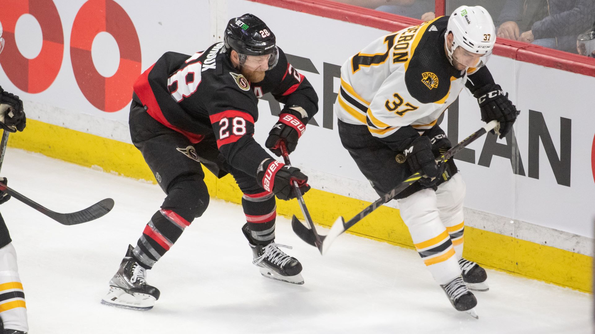 Ottawa Senators right wing Claude Giroux and Boston Bruins center Patrice Bergeron