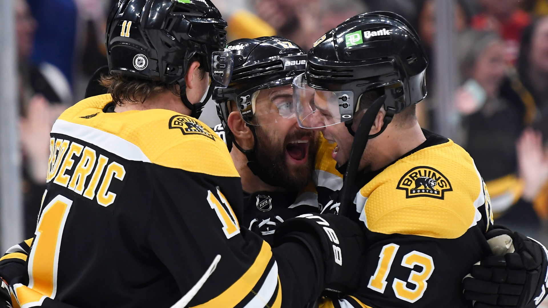 Boston Bruins forwards Nick Foligno, Charlie Coyle and Trent Frederic