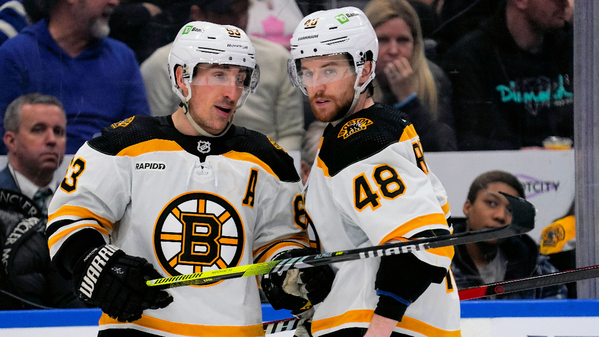 Boston Bruins left wing Brad Marchand, defenseman Matt Grzelcyk