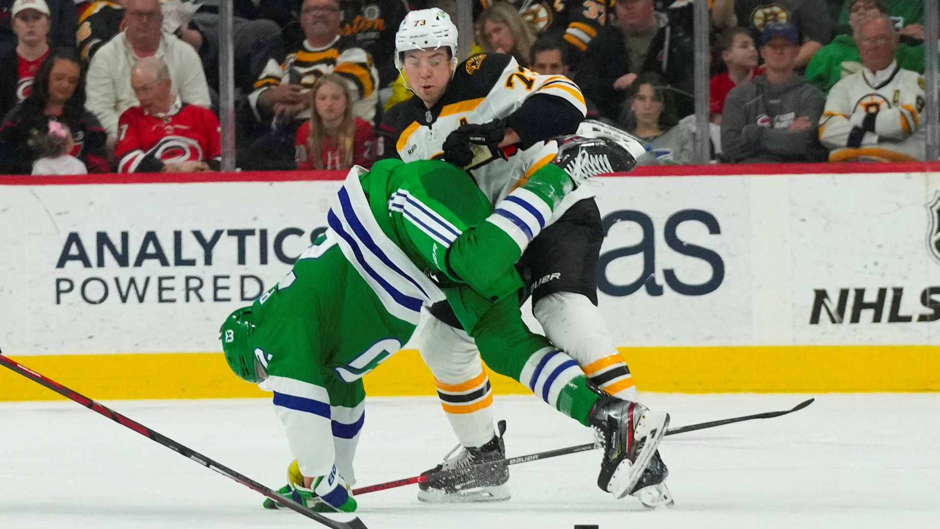 Carolina Hurricanes defenseman Brett Pesce and Boston Bruins defenseman Charlie McAvoy