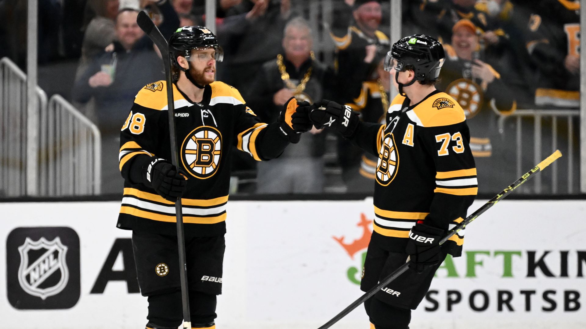 Boston Bruins teammates David Pastrnak and Charlie McAvoy