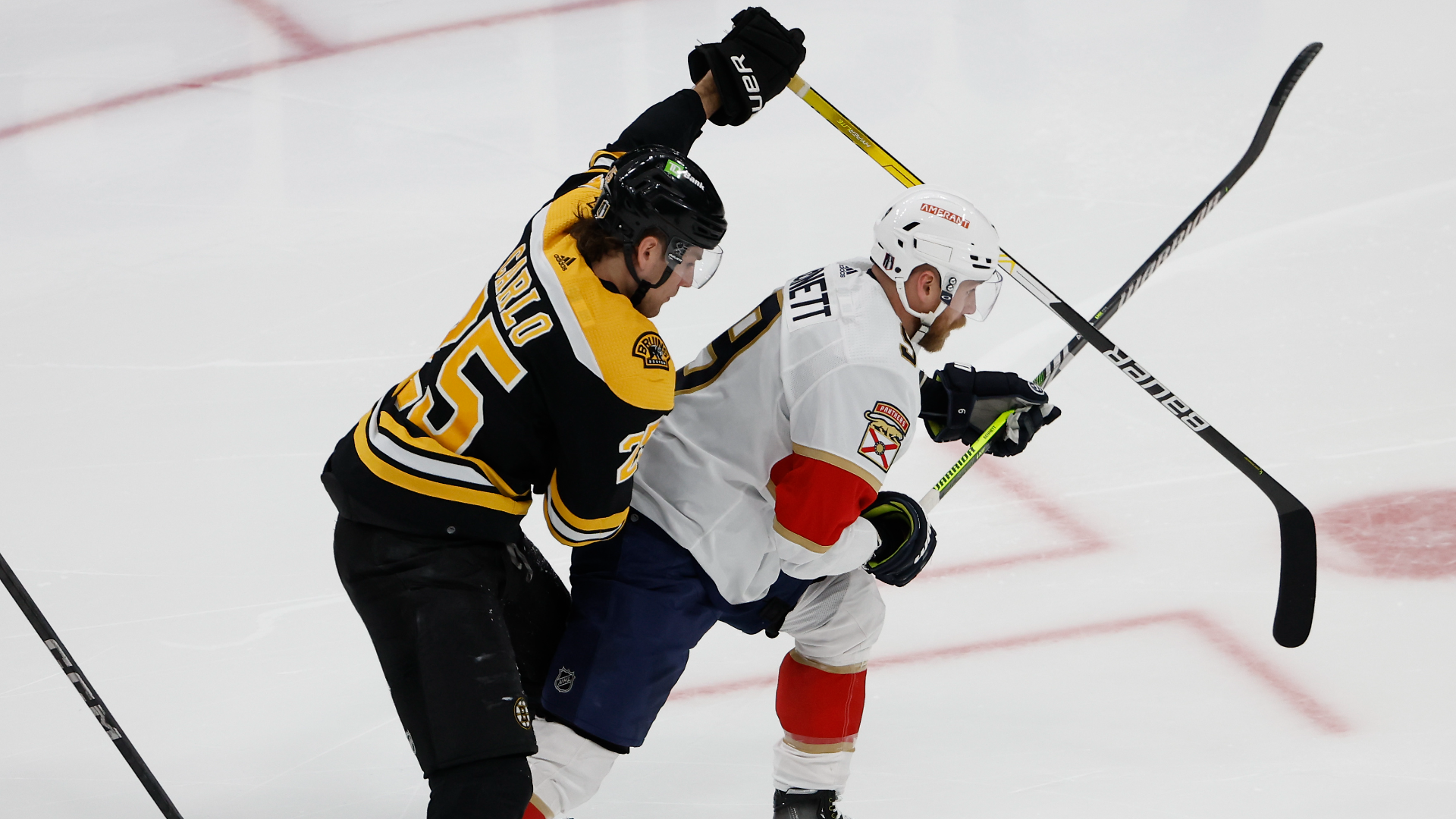 Boston Bruins defenseman Brandon Carlo and Florida Panthers center Sam Bennett