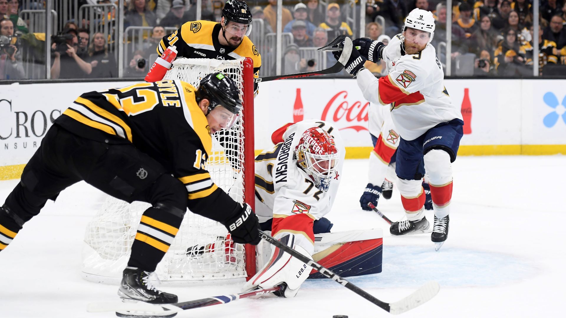 Boston Bruins center Charlie Coyle and Florida Panthers goalie Sergei Bobrovsky