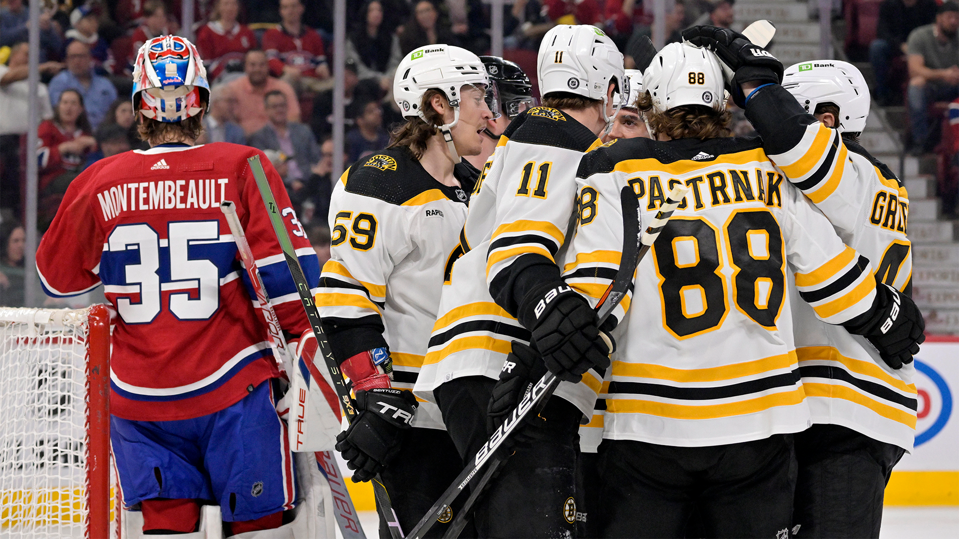 Boston Bruins forward David Pastrnak, Trent Frederic, Tyler Bertuzzi