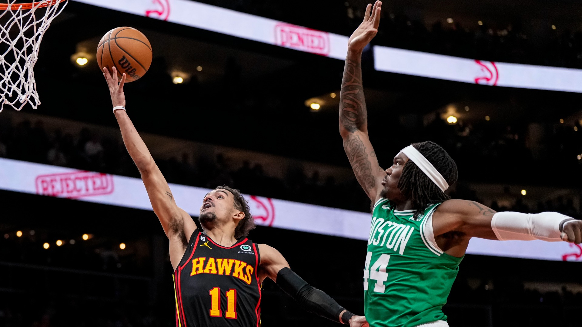 Atlanta Hawks guard Trae Young and Boston Celtics center Robert Williams