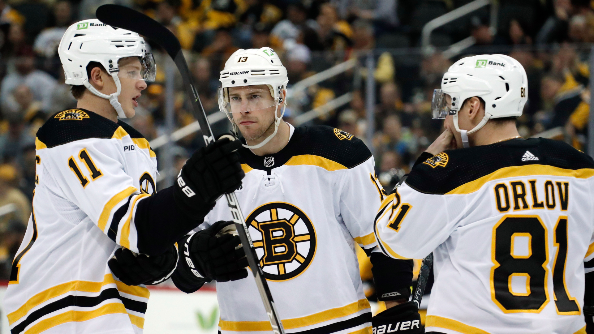 Boston Bruins forwards Trent Frederic and Charlie Coyle and defenseman Dmitry Orlov