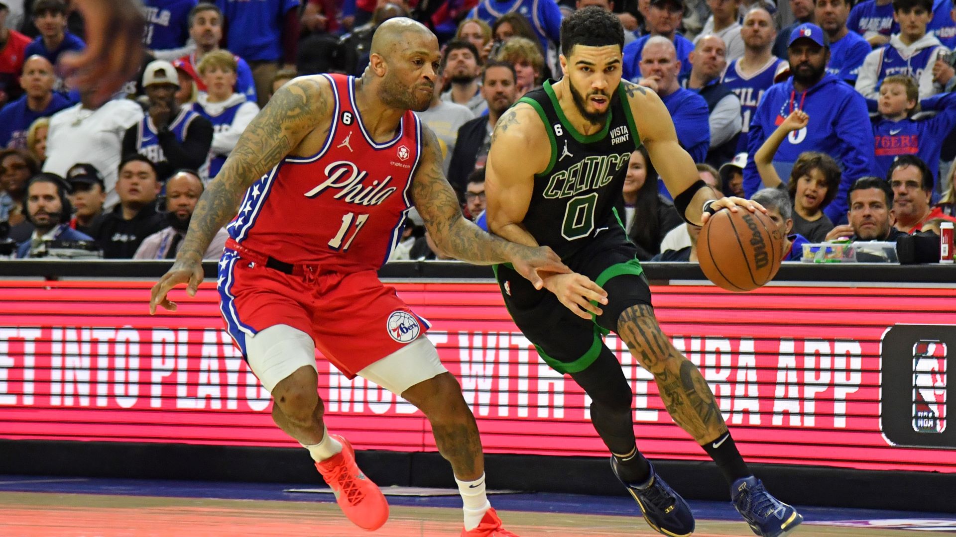 Philadelphia 76ers forward P.J. Tucker and Boston Celtics forward Jayson Tatum