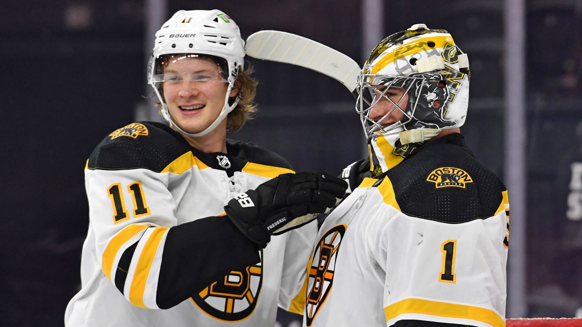 Boston Bruins teammates Trent Frederic and Jeremy Swayman