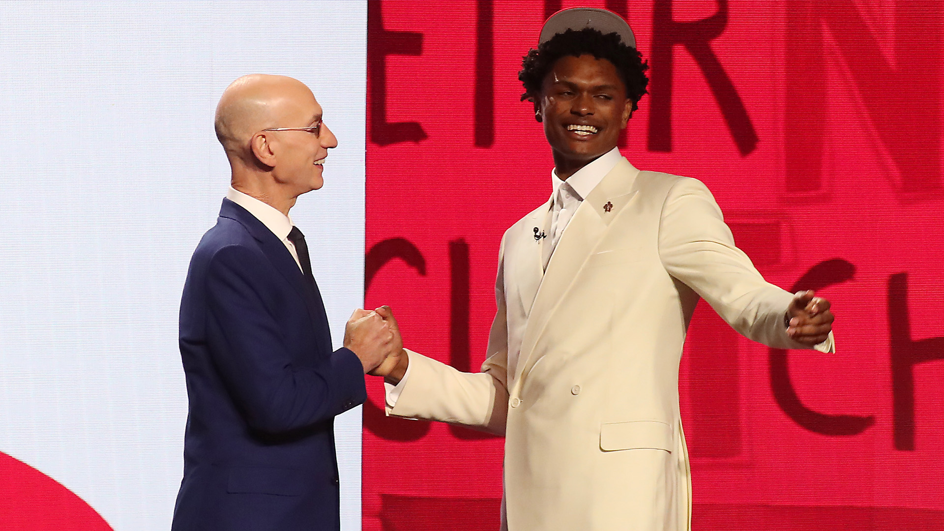 Amen Thompson reacts with NBA commissioner Adam Silver