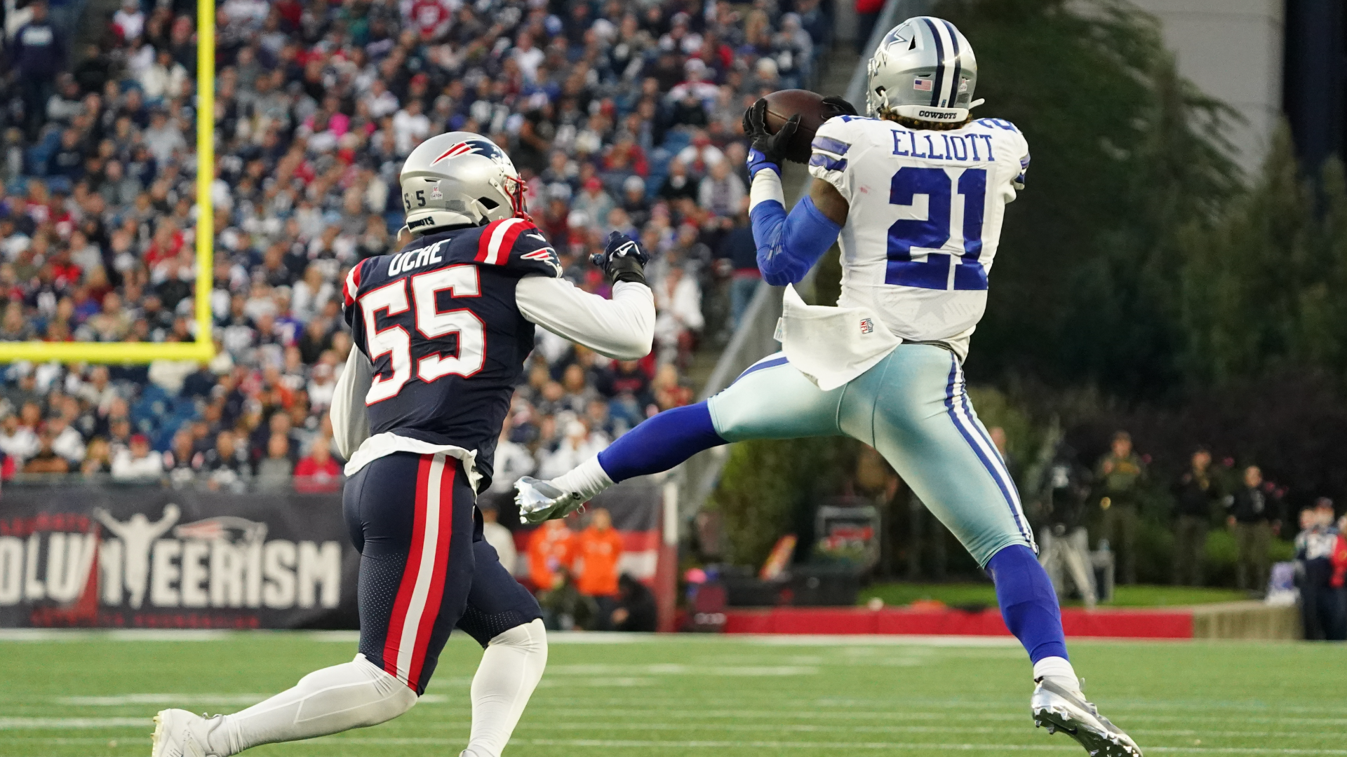 New England Patriots linebacker Josh Uche and running back Ezekiel Elliott