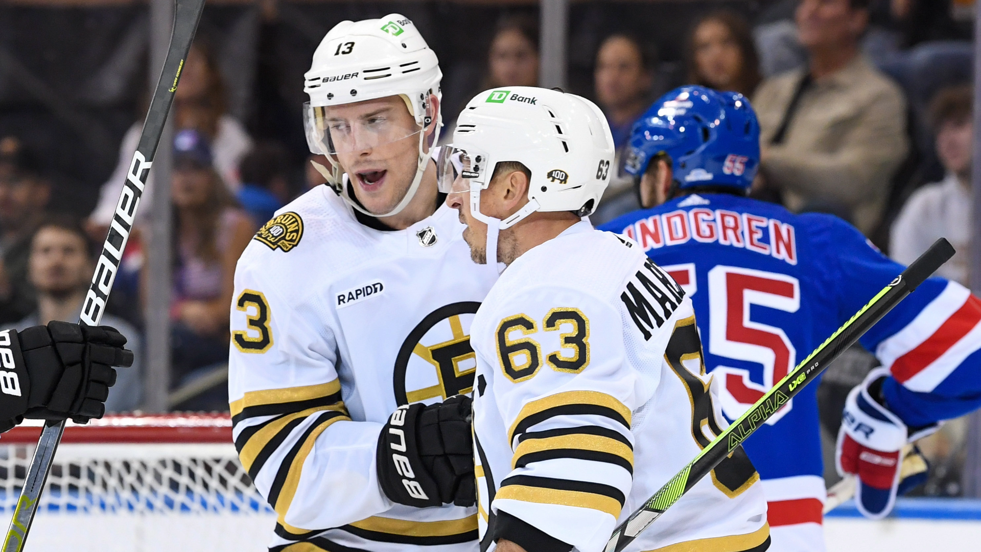 Boston Bruins center Charlie Coyle, left wing Brad Marchand