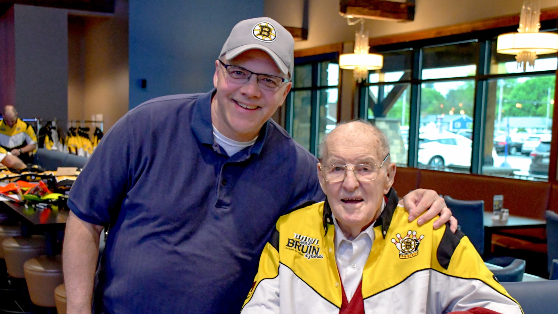 Boston Bruins Alumni Association media director Mark Willand and retired Boston Bruins forward Ed Sanford