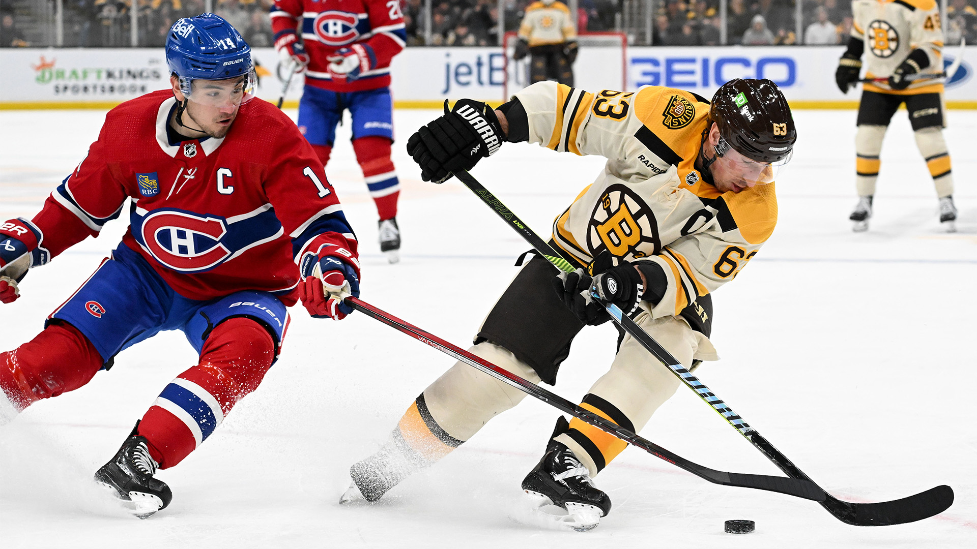 Boston Bruins captain Brad Marchand and Montreal Canadiens center Nick Suzuki