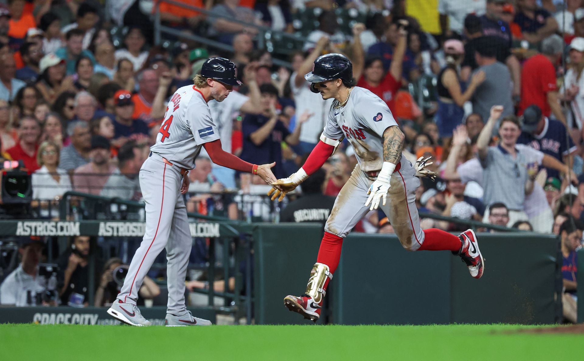 Boston Red Sox outfielder Jarren Duran and third base coach Kyle Hudson