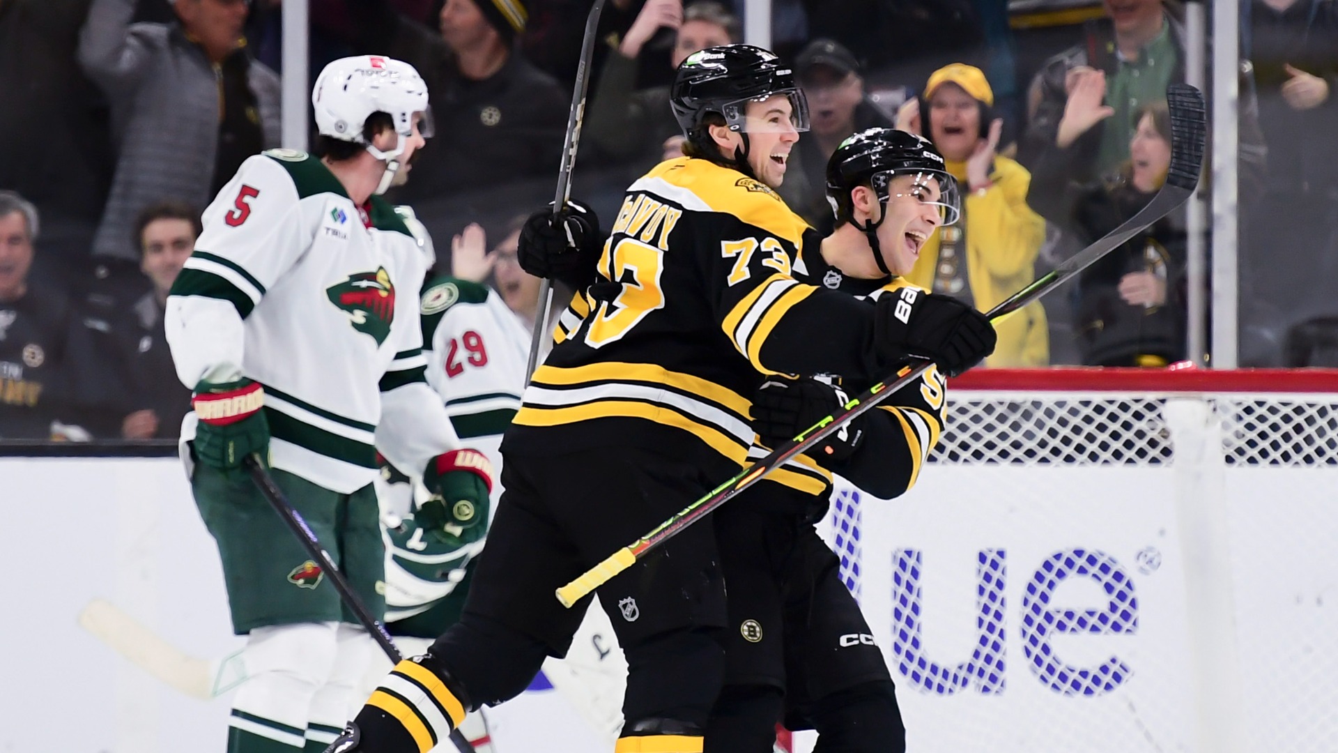 Boston Bruins defenseman Charlie McAvoy and forward Matthew Poitras