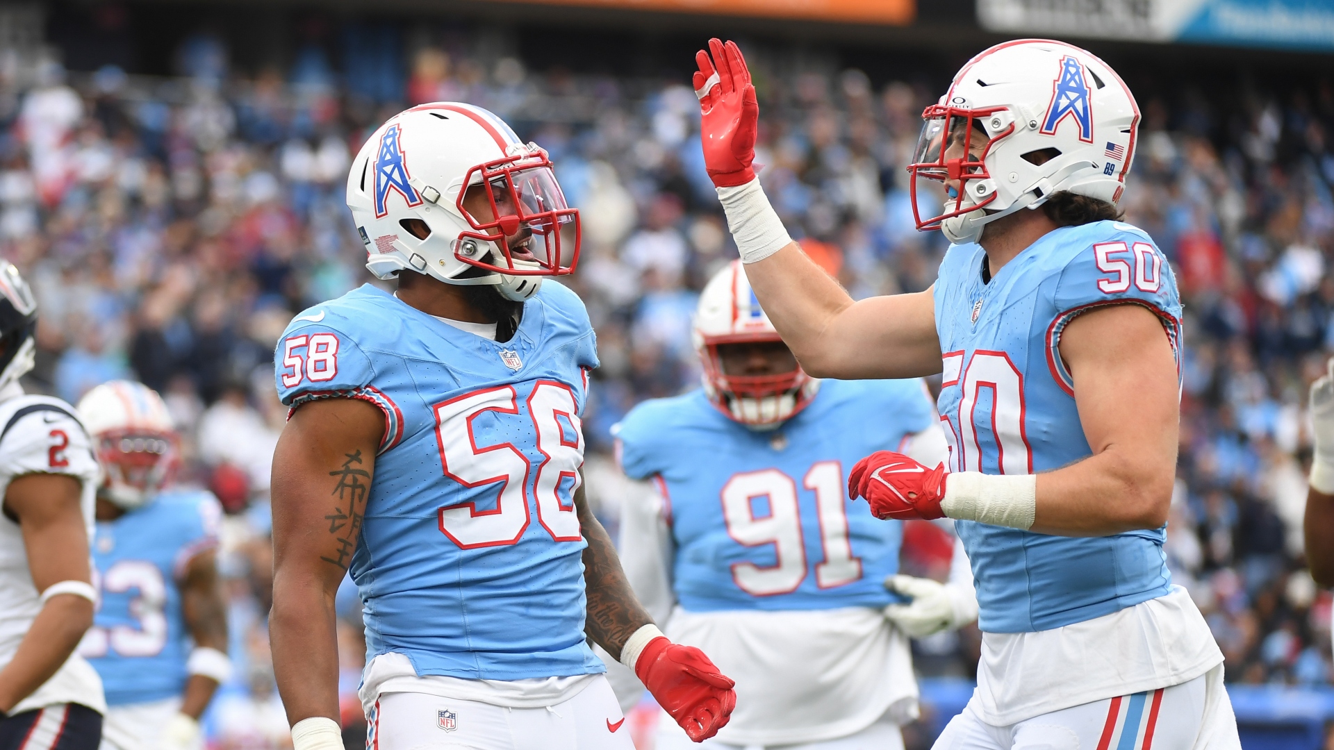 New England Patriots linebackers Harold Landry III and Jack Gibbens