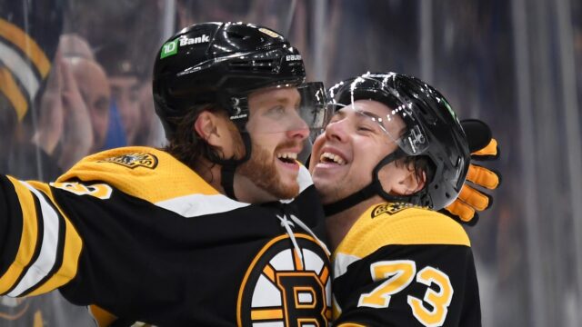 Boston Bruins teammates David Pastrnak and Charlie McAvoy