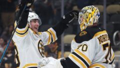 Boston Bruins forward Fraser Minten, goalie Joonas Korpisalo