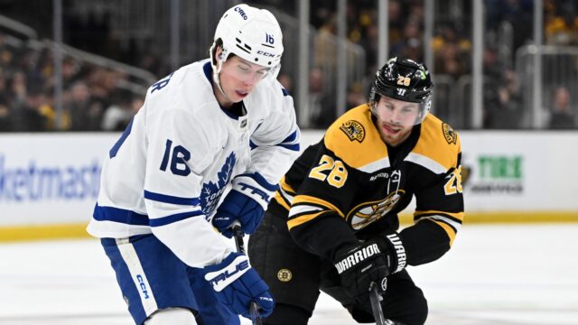 Boston Bruins forward Elias Lindholm and Toronto Maple Leafs forward Mitch Marner