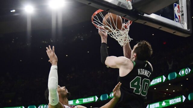 New York Knicks guard Josh Hart and Boston Celtics center Luke Kornet