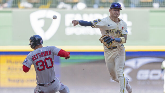 Boston Red Sox outfielder Rob Refsnyder and Milwaukee Brewers shortstop Joey Ortiz