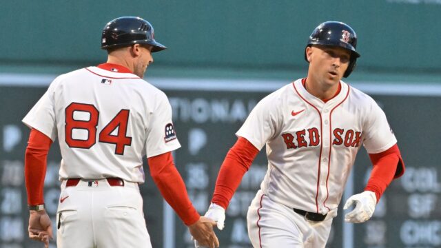 Boston Red Sox third baseman Alex Bregman, third base coach/outfield instructor Kyle Hudson